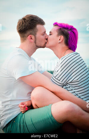 Young couple hugging and kissing on the nature Stock Photo