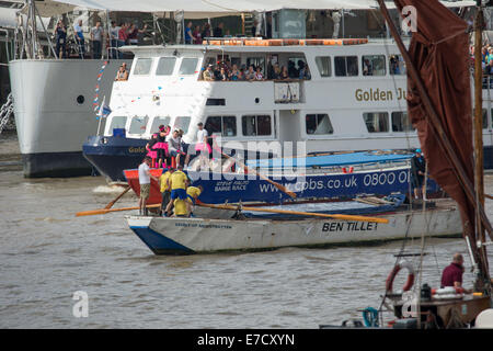 London, UK. 14th September 2014.  Two traditional Thames barges racing on the busy river from Waterloo Bridge to Tower Bridge competing in the annual Dave Pope Challenge Credit:  Neil Cordell/Alamy Live News Stock Photo