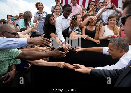 US President Barack Obama greets audience members after he delivers remarks on the economy at the Georgetown Waterfront Park July 1, 2014 in Washington, DC. Stock Photo