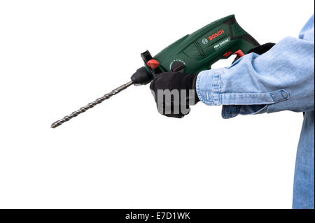 Man holding a Bosch SDS drill. Stock Photo