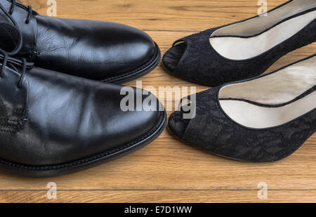 Man and womans shoes touching toe to toe. Stock Photo