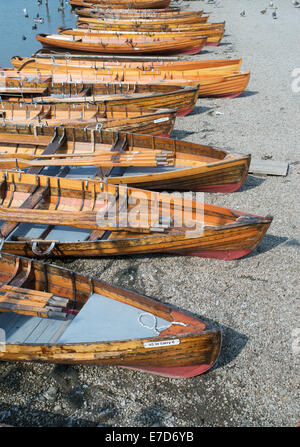 Group of rowing boats on the shore of Derwentwater at Keswick, Allerdale, Cumbria, England, UK Stock Photo
