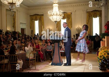 US President Barack Obama joins First Lady Michelle Obama onstage for a surprise visit during the Kids' State Dinner in the East Room of the White House July 18, 2014 in Washington, DC. Stock Photo