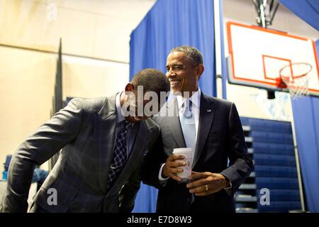 US President Barack Obama jokes with introducer Chris Paul prior to a 'My Brother's Keeper' initiative town hall at the Walker Jones Education Campus July 21, 2014 in Washington, DC. Stock Photo