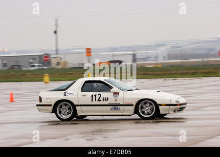 A 1987 White Mazda RX-7 Turbo in an autocross race at a regional Sports Car Club of America (SCCA) event Stock Photo