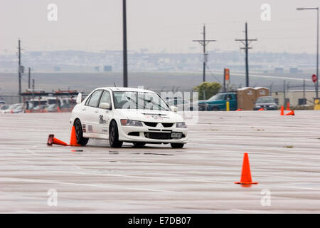 A white 2003 Mitsubishi Lancer Evolution Viii in an autocross race at a regional Sports Car Club of America (SCCA) event Stock Photo