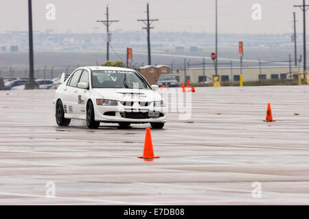 A white 2003 Mitsubishi Lancer Evolution Viii in an autocross race at a regional Sports Car Club of America (SCCA) event Stock Photo