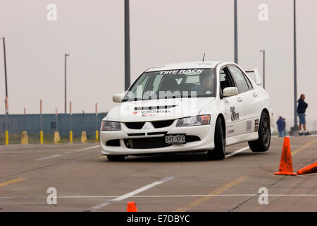 A 2003 white Mitsubishi Lancer Evolution Viii in an autocross race at a regional Sports Car Club of America (SCCA) event Stock Photo