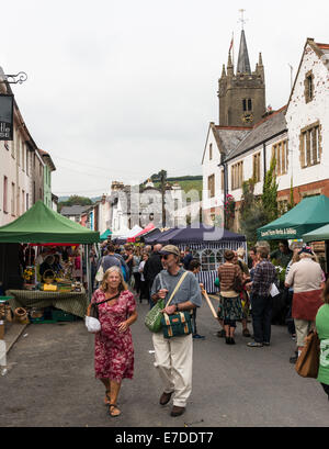 Ashburton Food & Drink Festival view of the street market and stalls with church steeple in the background. Stock Photo