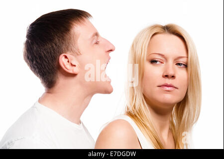Man screaming at his girlfriend over white background Stock Photo