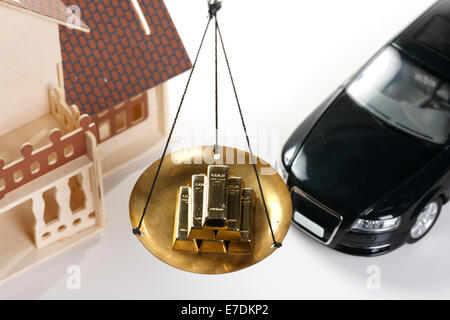 Architectural model,car model and gold bars Stock Photo