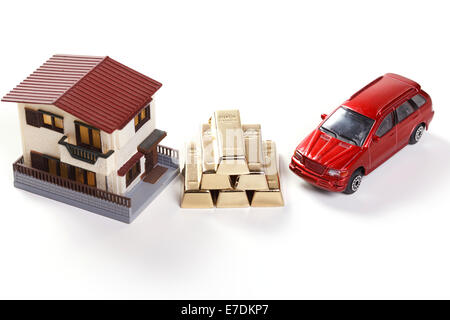 Architectural model,car model and gold bars Stock Photo