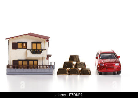 Architectural model,car model and gold bars Stock Photo