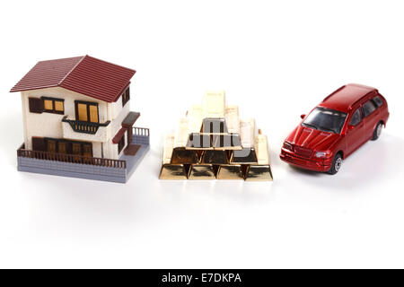 Architectural model,car model and gold bars Stock Photo