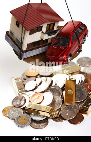 Architectural model,car model and gold bars Stock Photo