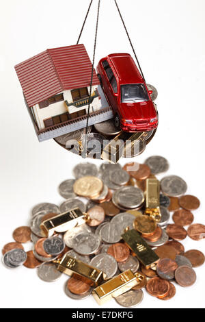 Architectural model,car model and gold bars Stock Photo