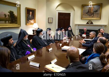 US President Barack Obama attends a meeting with Lebanese Maronite Patriarch Bechara Rai and Religious Leaders in the Roosevelt Room of the White House September 11, 2014 in Washington, DC. Stock Photo