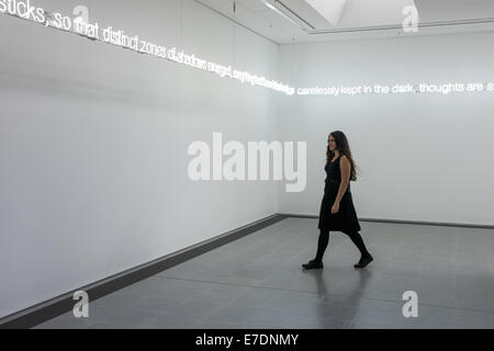 London, UK. 15th Sep, 2014. a member of the staff walks during the press preview of the new exhibition by Cerith Wyn Evans at Serpentine Sackler Gallery. Credit:  Piero Cruciatti/Alamy Live News Stock Photo