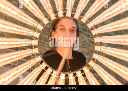 London, UK. 15th Sep, 2014. A member of the staff looks at ‘Column (Assemblages) IX, 2010’ by Cerith Wyn Evans during the press preview of his new solo exhibition at Serpentine Sackler Gallery. Credit:  Piero Cruciatti/Alamy Live News Stock Photo