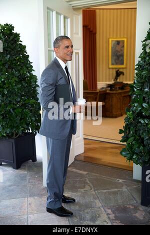 US President Barack Obama stands on the Colonnade outside the Oval Office upon arrival from the Department of Housing and Urban Development July 31, 2014 in Washington, DC. Stock Photo