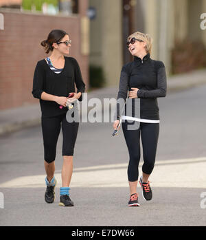 Nikki Reed and Julianne Hough share a laugh after bumping into each outside a gym, following a workout  Featuring: Nikki Reed Julianne Hough Where: Los Angeles, California, United States When: 11 Mar 2014 Stock Photo