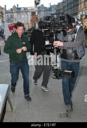 Former Liverpool FC striker Robbie Fowler spotted filming for a Carlsberg #Allthegreats promotion outside The Gaiety Theatre. Comedienne Hilary Rose was also spotted working at the filming  Featuring: Robbie Fowler Where: Dublin, Ireland When: 12 Mar 2014 Stock Photo