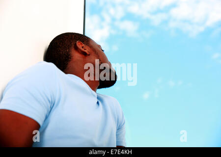 Portrait of african man looking at window Stock Photo