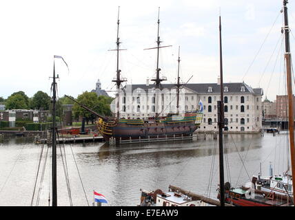 Dutch National Maritime Museum (Scheepvaartmuseum) in Amsterdam, The Netherlands. Replica VOC-ship Amsterdam moored in front. Stock Photo