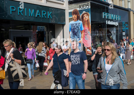 Shoppers strolling by the Primark store on Princes Street, Edinburgh, Scotland, UK Stock Photo