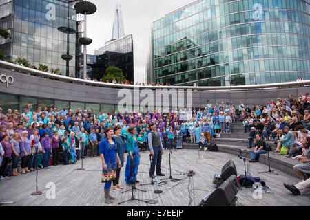 Adults choir, made from choirs from all over the region, perform at The Scoop. Totally Thames Festival, London, UK. Stock Photo