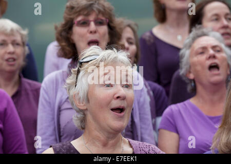 Adults choir, made from choirs from all over the region, perform at The Scoop. Totally Thames Festival, London, UK. Stock Photo