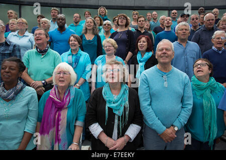 Adults choir, made from choirs from all over the region, perform at The Scoop. Totally Thames Festival, London, UK. Stock Photo