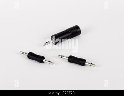 Three different stereo adapters mini-jacks (3.5 mm) on white background Stock Photo