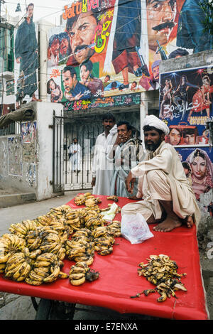 Fruit seller in front of a movie theatre, Lahore, Pakistan, South Asia Stock Photo