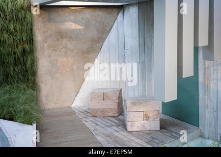 Garden - A Garden of Solitude - contemporary pergola with garden made from recycled and reused materials reclai Stock Photo