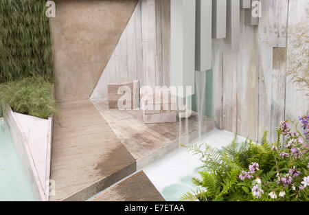 Garden - A Garden of Solitude - contemporary pergola with garden made from recycled and reused materials Stock Photo