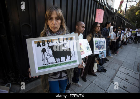 Buenos Aires, Argentina. 15th Sep, 2014. A woman holds a placard during a protest against the killing of bulls in front of the Spanish embassy in Buenos Aires, Argentina, on Sept 15, 2014. Members of animal rights organizations gathered in front of the Spanish embassy to protest against the killing of bulls in the framework of the Toro de la Vega Tournament of Torsedillas, Spain, which takes place the second Tuesday of September and involves spearing a bull to death. © Martin Zabala/Xinhua/Alamy Live News Stock Photo