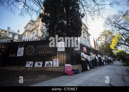 Buenos Aires, Argentina. 15th Sep, 2014. Activists take part in a protest against the killing of bulls in front of the Spanish embassy in Buenos Aires, Argentina, on Sept 15, 2014. Members of animal rights organizations gathered in front of the Spanish embassy to protest against the killing of bulls in the framework of the Toro de la Vega Tournament of Torsedillas, Spain, which takes place the second Tuesday of September and involves spearing a bull to death. © Martin Zabala/Xinhua/Alamy Live News Stock Photo