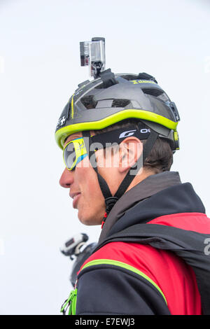 Base jumpers wearing wing suites prepare to jump from the Aiguille Du midi above Chamonix, France. Stock Photo