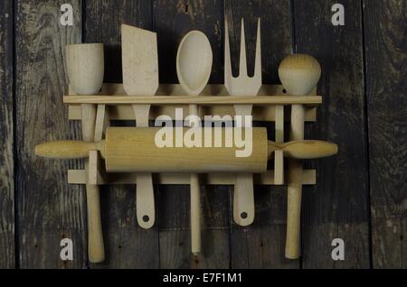 wooden kitchen accessories on background of board Stock Photo