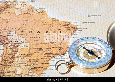 Compass on a map pointing at Brazil, planning a travel destination Stock Photo