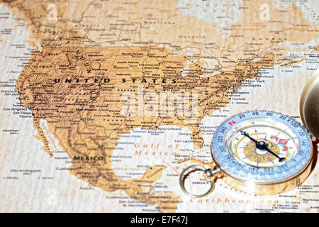Compass on a map pointing at United States, planning a travel destination