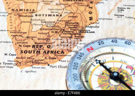 Compass on a map pointing at South Africa, planning a travel destination Stock Photo