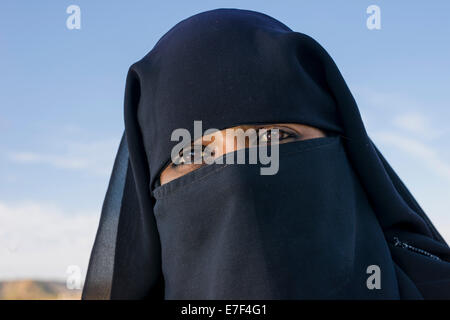 A portrait of a young veiled Muslim woman visiting the Bibi Ka Maqbara, Aurangabad, Maharashtra, India Stock Photo