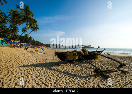 An old fishing boat on Palolem Beach, Canacona, Goa, India Stock Photo