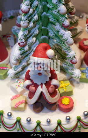 Santa Claus figure made of marzipan, decoration on a cake, in the window of a pastry shop, Düsseldorf, North Rhine-Westphalia Stock Photo