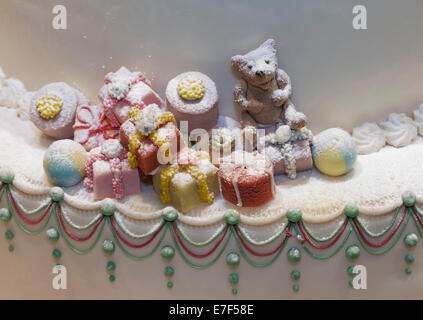 Christmas gifts and a teddy bear made of marzipan, decoration on a cake, Düsseldorf, North Rhine-Westphalia, Germany Stock Photo