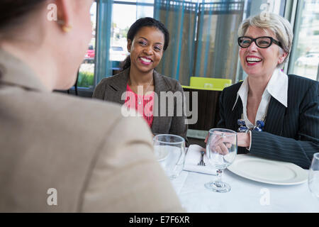 Businesswomen talking in restaurant Stock Photo