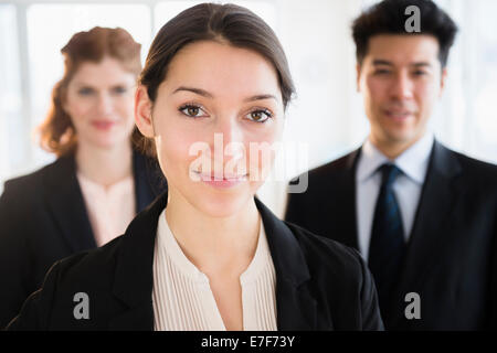 Business people smiling in office Stock Photo