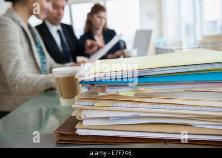 Stack of papers on desk in office Stock Photo